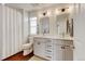Bathroom features a double vanity with undermount sinks and decorative lighting at 629 Jackson St, Lafayette, CO 80026