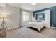 Bright bedroom with a Murphy bed, large window, and modern decor at 629 Jackson St, Lafayette, CO 80026
