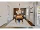 Well-appointed dining room showcasing a stylish light fixture, hardwood floors, and an inviting atmosphere at 629 Jackson St, Lafayette, CO 80026