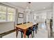 Beautiful dining area featuring natural light, hardwood floors, and a view into the open-concept living space at 629 Jackson St, Lafayette, CO 80026