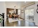 Bright dining room with wood floors, stylish lighting, and sliding glass doors to outdoor space at 629 Jackson St, Lafayette, CO 80026
