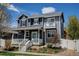 Charming two-story home featuring a welcoming front porch, a second story balcony and professionally landscaped front yard at 629 Jackson St, Lafayette, CO 80026