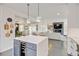 Well-designed kitchen with a center island, pendant lighting, and open layout connected to the living area at 629 Jackson St, Lafayette, CO 80026