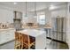 Contemporary kitchen boasting modern appliances, sleek cabinetry, a center island with seating, and abundant natural light at 629 Jackson St, Lafayette, CO 80026