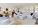 Open-concept living room with seamless flow to the kitchen and dining area, enhancing the sense of spaciousness at 629 Jackson St, Lafayette, CO 80026