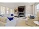 Bright and airy living room featuring a modern fireplace, recessed lighting, and comfortable seating arrangement at 629 Jackson St, Lafayette, CO 80026