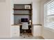 Dedicated office area with built-in shelves, desk, and ample natural light at 629 Jackson St, Lafayette, CO 80026