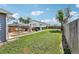Expansive backyard features a lawn, wooden deck, a grill, and an outdoor storage unit at 130 N 8Th Ave, Brighton, CO 80601