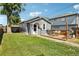 Charming backyard featuring a grassy area, wooden deck, and a grill, perfect for outdoor gatherings at 130 N 8Th Ave, Brighton, CO 80601