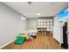 Finished basement area with laminate flooring, a play area and a dresser at 130 N 8Th Ave, Brighton, CO 80601