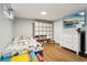 Playful finished basement featuring wood floors and a cozy bedroom area at 130 N 8Th Ave, Brighton, CO 80601