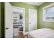 A neutral bedroom reveals entry to the living room and a standard closet at 130 N 8Th Ave, Brighton, CO 80601
