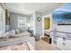 Comfortable living room with modern decor, a large gray sofa, and an adjacent doorway to the bedroom at 130 N 8Th Ave, Brighton, CO 80601