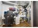 Storage space featuring a desk, gaming chair, television and shelving units at 130 N 8Th Ave, Brighton, CO 80601