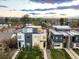 Modern townhomes with manicured front lawns, contemporary architecture, and solar panels at 2685 S Acoma St, Denver, CO 80223