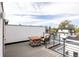 Rooftop deck with outdoor seating and fire pit table, offering a relaxing space with views of the neighborhood at 2685 S Acoma St, Denver, CO 80223