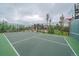 Private basketball court surrounded by lush greenery, providing a fun and active recreational space with the house in background at 34650 Sleeping Fox Trl, Evergreen, CO 80439