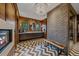 Contemporary bathroom showcasing stone accent wall, fireplace, and modern fixtures at 34650 Sleeping Fox Trl, Evergreen, CO 80439