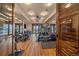Home gym with modern fitness equipment, hardwood floors, recessed lighting, and great views at 34650 Sleeping Fox Trl, Evergreen, CO 80439