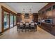Bright and spacious kitchen featuring a large island, custom cabinetry, and stainless steel appliances at 34650 Sleeping Fox Trl, Evergreen, CO 80439