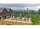 Rooftop deck features an outdoor kitchen, multiple seating areas, and panoramic mountain views at 34650 Sleeping Fox Trl, Evergreen, CO 80439