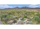 Scenic aerial view of a neighborhood nestled in lush greenery with mountain backdrop at 4740 Lee Cir, Boulder, CO 80303