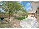Large backyard featuring a concrete patio, lawn and stone landscaping with a wooden fence at 4740 Lee Cir, Boulder, CO 80303