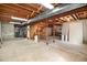 Unfinished basement with exposed wooden beams, concrete floor and stairs at 4740 Lee Cir, Boulder, CO 80303