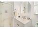 This bathroom has a shower behind a sliding door, a vanity and a mirror above it at 4740 Lee Cir, Boulder, CO 80303