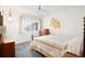 This bedroom has a blue rug on the floor, a bed with a patterned blanket, and a window at 4740 Lee Cir, Boulder, CO 80303