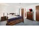 Well-lit bedroom featuring a wooden bed frame, matching nightstands, and a spacious closet with neutral decor at 4740 Lee Cir, Boulder, CO 80303