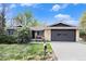 Charming home with lush front yard, a well-kept lawn and a two-car garage at 4740 Lee Cir, Boulder, CO 80303