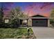 Charming single-story home with a well-manicured lawn and a two-car garage beneath a dramatic evening sky at 4740 Lee Cir, Boulder, CO 80303