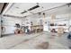 Spacious garage with a ramp, shelving, tool bench, and overhead lighting at 4740 Lee Cir, Boulder, CO 80303