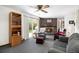 Cozy living room features a brick fireplace, comfortable seating, and a sliding door to the outdoor space at 4740 Lee Cir, Boulder, CO 80303