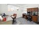 Office space features carpeted flooring, a large window, two desks and a rolling chair at 4740 Lee Cir, Boulder, CO 80303