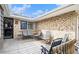 Outdoor patio with brick wall, wrought iron furniture and wooden deck at 4740 Lee Cir, Boulder, CO 80303