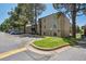 Exterior view of building showing ample parking and nearby greenery at 9700 E Iliff Ave # A3, Denver, CO 80231
