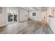 Bright living room with wood floors, white trim, and sliding door access to outdoor area at 9700 E Iliff Ave # A3, Denver, CO 80231