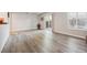 Well-lit living room boasts new flooring, white trim, and access to outdoor space at 9700 E Iliff Ave # A3, Denver, CO 80231