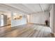 Open concept living room leading to kitchen with stainless steel appliances at 9700 E Iliff Ave # A3, Denver, CO 80231