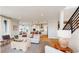 Bright and airy living room seamlessly blends with a modern kitchen and dining area at 5567 Moosehead Cir, Longmont, CO 80503