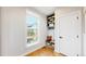 Welcoming mud room with built-in bench, shelving, and window, offering both functionality and natural light at 5567 Moosehead Cir, Longmont, CO 80503