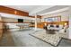 Spacious basement rec room featuring a billiards table, a comfortable sitting area, and wood-paneled accents at 6723 Perry Park Blvd, Larkspur, CO 80118