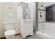 Modern bathroom featuring sleek fixtures, a glass shower, and a pristine white vanity for a clean aesthetic at 6723 Perry Park Blvd, Larkspur, CO 80118