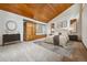 Spacious bedroom with wood-paneled ceilings and large windows, creating a serene atmosphere at 6723 Perry Park Blvd, Larkspur, CO 80118
