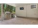 Covered patio features a built-in grill, and a view of the surrounding yard at 6723 Perry Park Blvd, Larkspur, CO 80118