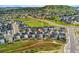 Beautiful aerial view of a suburban neighborhood nestled amongst green spaces and rolling hills at 52 Simmental Loop, Castle Rock, CO 80104