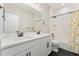 Modern bathroom featuring a double vanity, white subway tile, and sleek black hardware at 52 Simmental Loop, Castle Rock, CO 80104