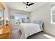 This bright bedroom features a large window with neighborhood views and neutral colored walls at 52 Simmental Loop, Castle Rock, CO 80104